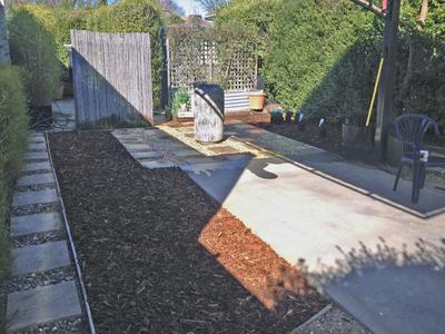 The finished Courtyard for Adrien & Marilyn - with urn, pavers, gravel and mulch installed